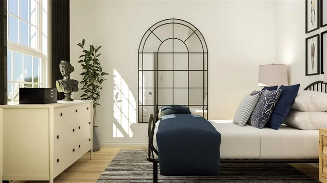 a bedroom with a bed and a window