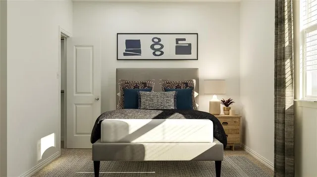 a bedroom with a bed and a table