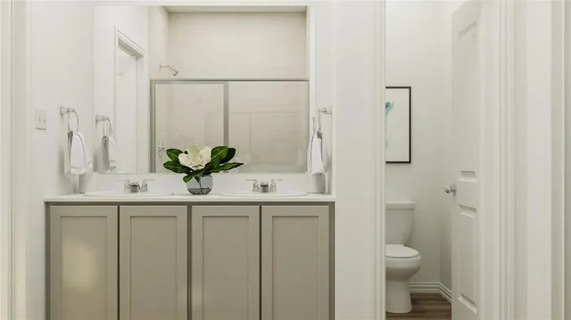 a bathroom with a glass shower door