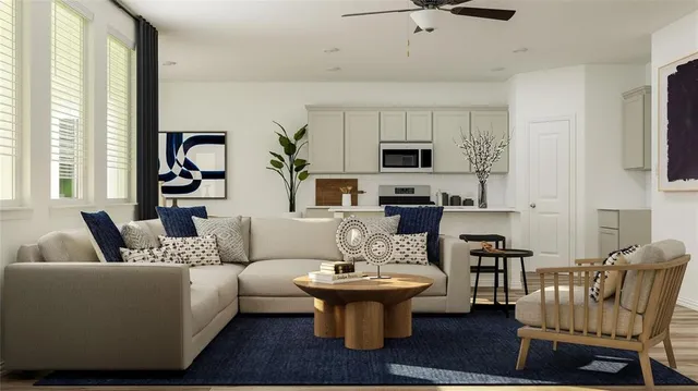 a living room with furniture a flat screen tv and a large window