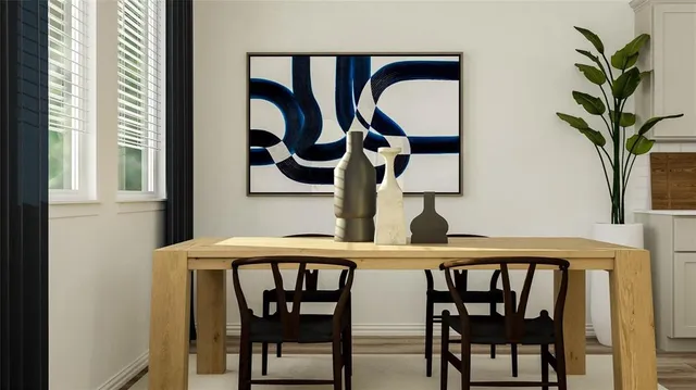 a table with chairs and a potted plant