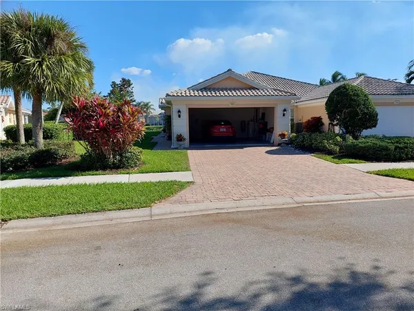 front view of a house with a garden