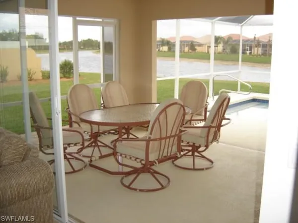 a view of a dining room with furniture window and outside view