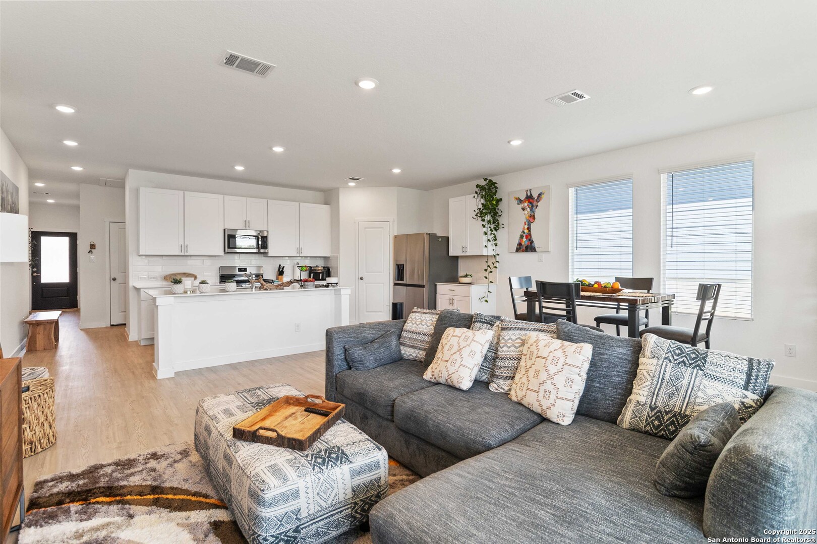 5708 Basil Chase St. Hedwig, TX 78152 - Photo 12 of 24 a living room with furniture and kitchen view