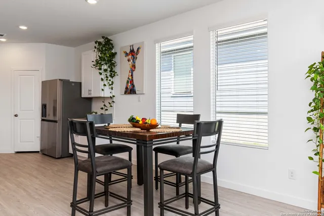 a table and chairs in a kitchen