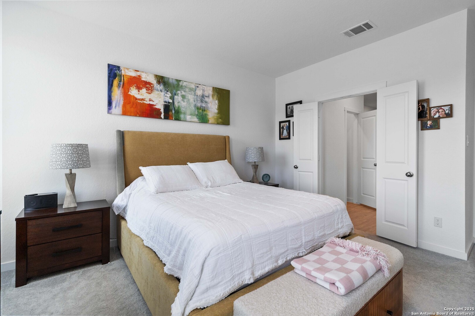 5708 Basil Chase St. Hedwig, TX 78152 - Photo 14 of 24 a bedroom with a bed and a lamp on dresser