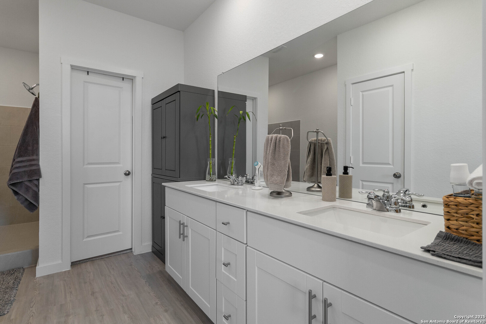 5708 Basil Chase St. Hedwig, TX 78152 - Photo 16 of 24 a bathroom with double sink and a mirror