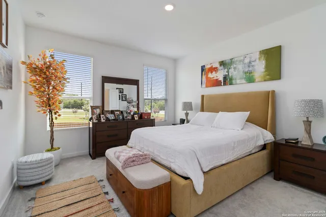 a room with a bed and a flat screen tv