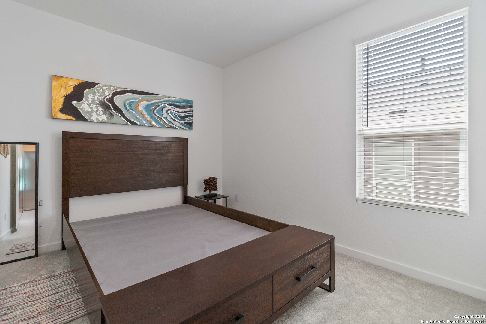 5708 Basil Chase St. Hedwig, TX 78152 - Photo 21 of 24 a room with a bed and a flat screen tv