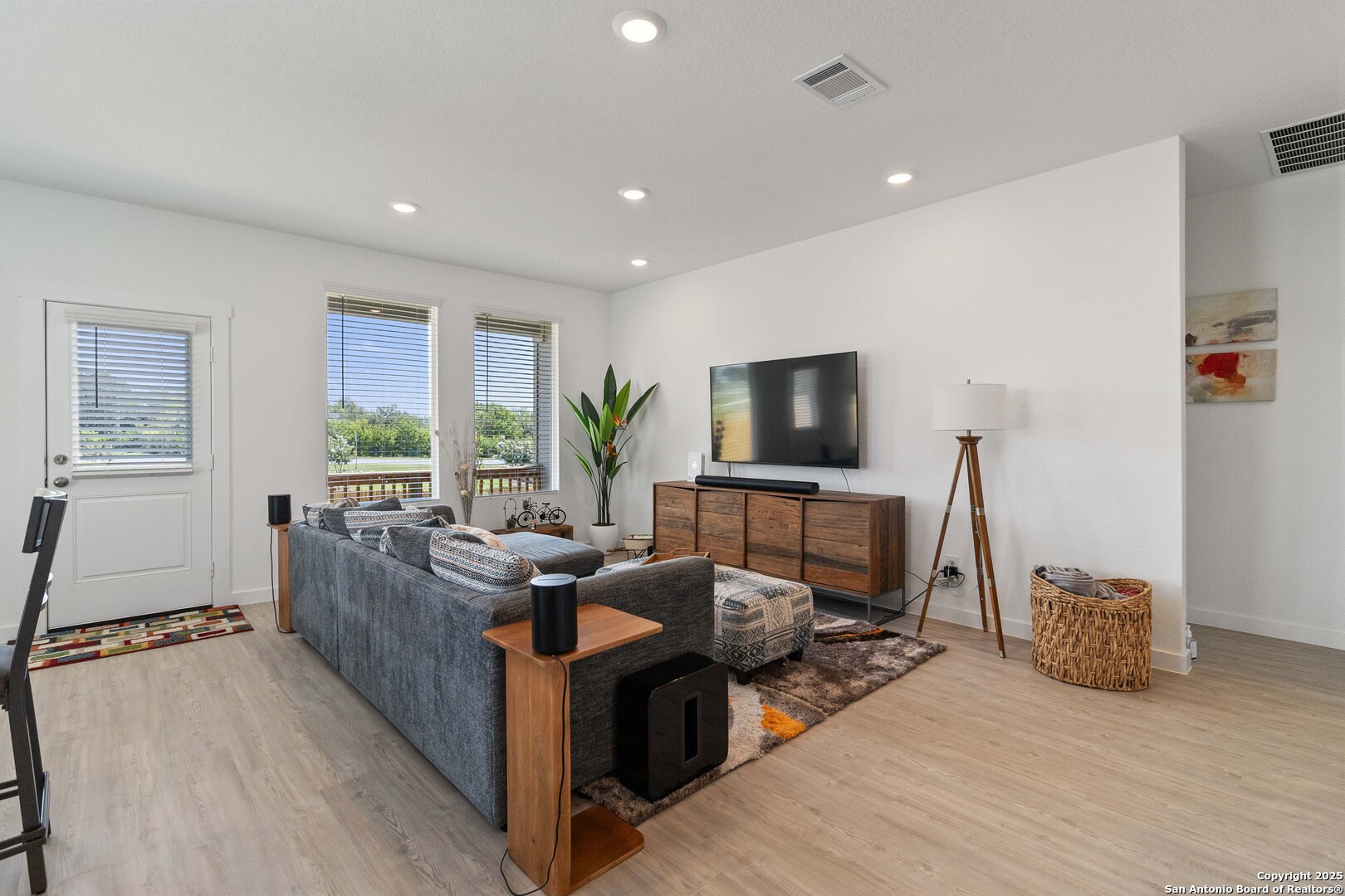 5708 Basil Chase St. Hedwig, TX 78152 - Photo 9 of 24 a living room with furniture and a flat screen tv