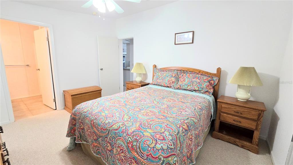 10303 Burnt Store Road, Unit 93 Punta Gorda, FL 33950 - Photo 18 of 65 a bedroom with a bed and a window