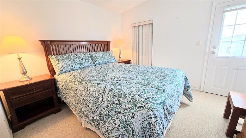 10303 Burnt Store Road, Unit 93 Punta Gorda, FL 33950 - Photo 25 of 65 a bed sitting in a bedroom next to a window