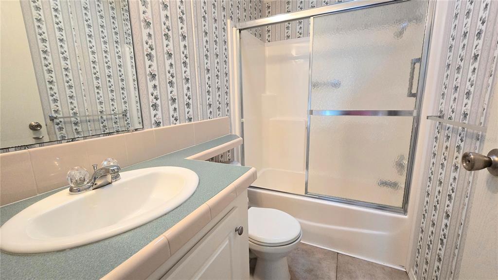 10303 Burnt Store Road, Unit 93 Punta Gorda, FL 33950 - Photo 26 of 65 a bathroom with a sink toilet and shower