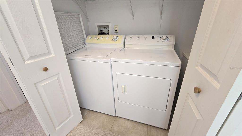 10303 Burnt Store Road, Unit 93 Punta Gorda, FL 33950 - Photo 27 of 65 a utility room with dryer and washer