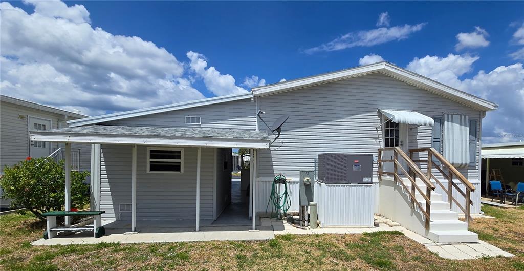 10303 Burnt Store Road, Unit 93 Punta Gorda, FL 33950 - Photo 29 of 65 a backyard of a house