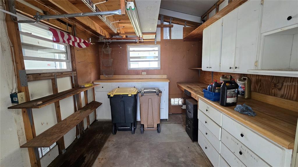 10303 Burnt Store Road, Unit 93 Punta Gorda, FL 33950 - Photo 37 of 65 a kitchen with window and cabinets