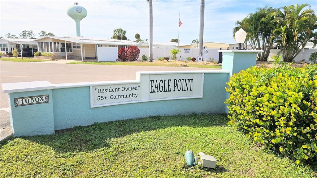 10303 Burnt Store Road, Unit 93 Punta Gorda, FL 33950 - Photo 38 of 65 a view of a street with a building and a street sign
