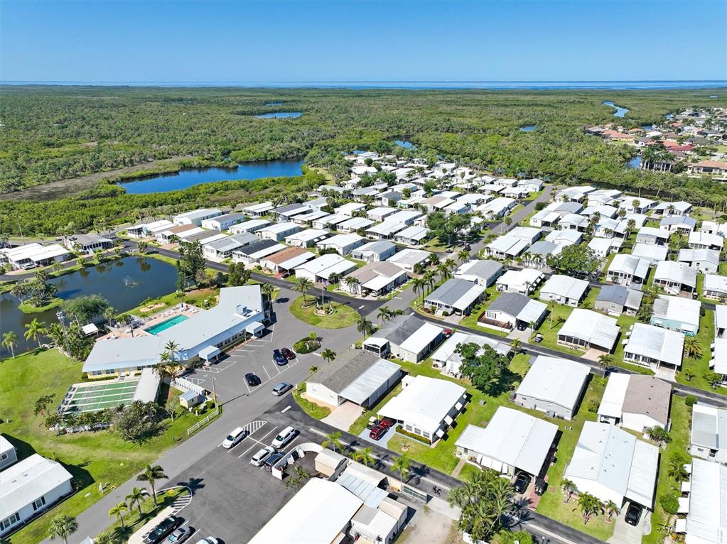 10303 Burnt Store Road, Unit 93 Punta Gorda, FL 33950 - Photo 39 of 65 an aerial view of residential building and lake