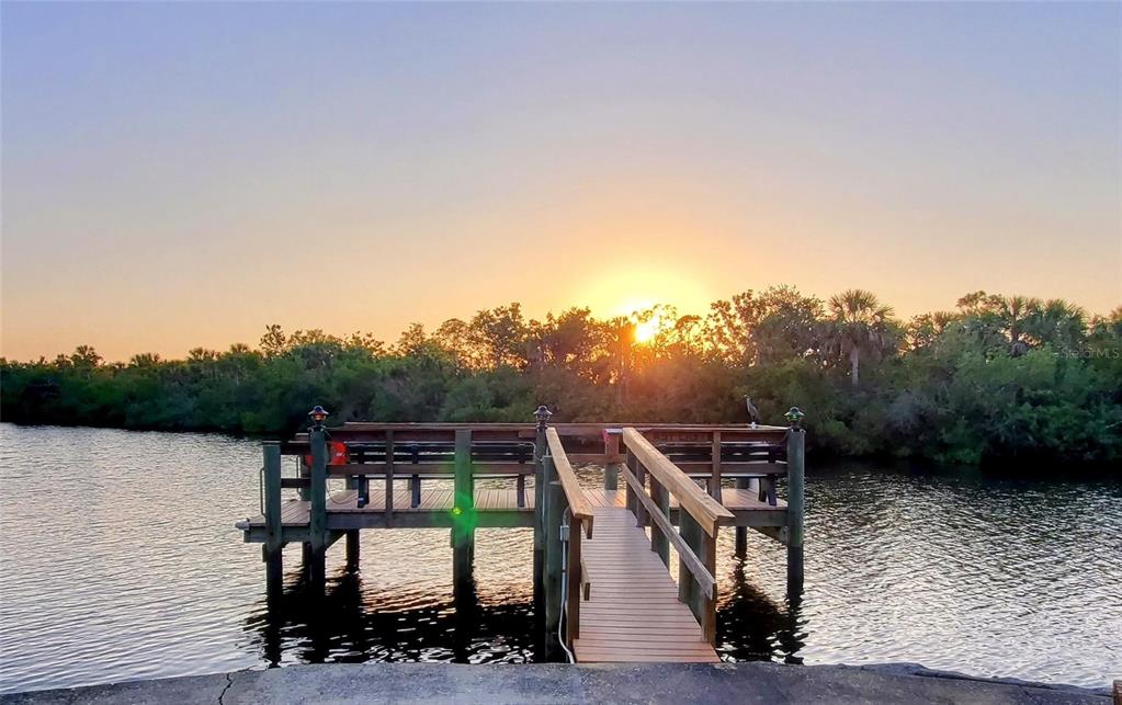 10303 Burnt Store Road, Unit 93 Punta Gorda, FL 33950 - Photo 50 of 65 a view of a lake with a mountain in the background