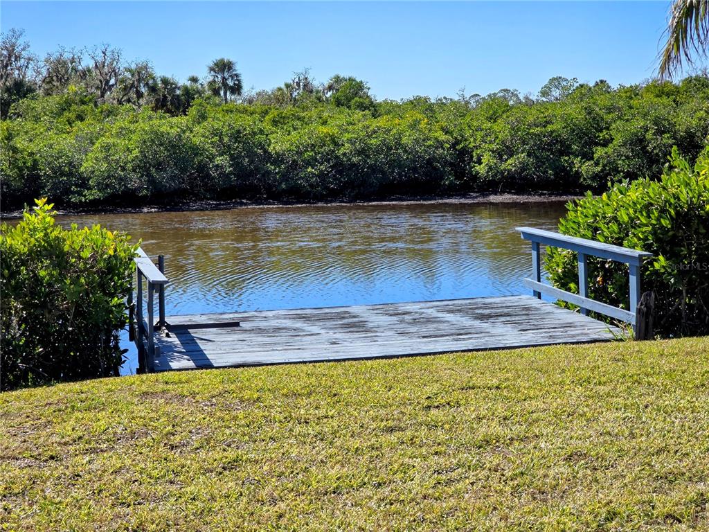 10303 Burnt Store Road, Unit 93 Punta Gorda, FL 33950 - Photo 59 of 65 a view of a swimming pool with a yard