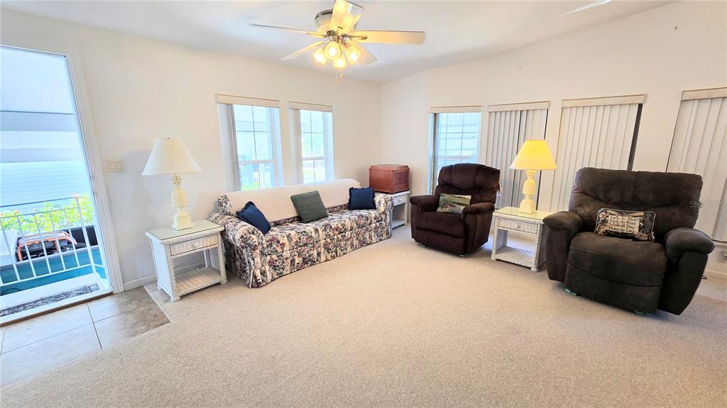 10303 Burnt Store Road, Unit 93 Punta Gorda, FL 33950 - Photo 6 of 65 a living room with furniture and a window
