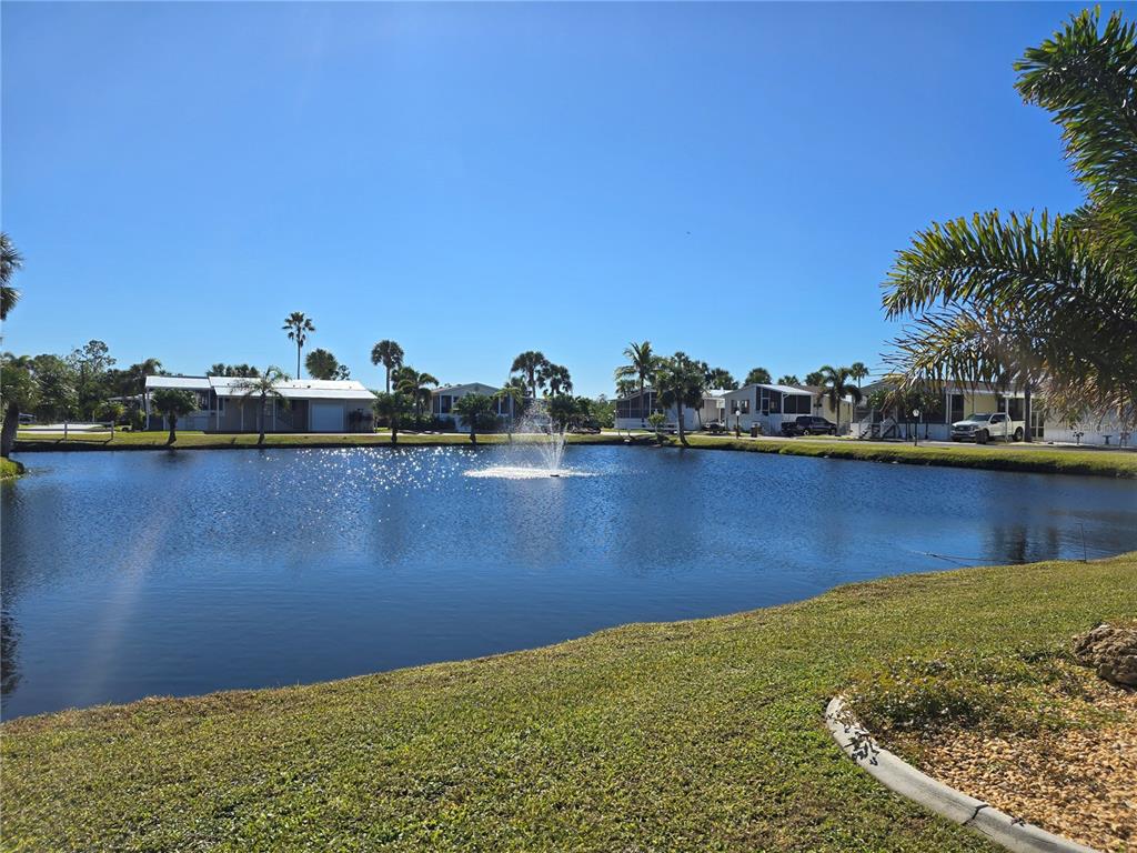 10303 Burnt Store Road, Unit 93 Punta Gorda, FL 33950 - Photo 63 of 65 a view of a lake with houses