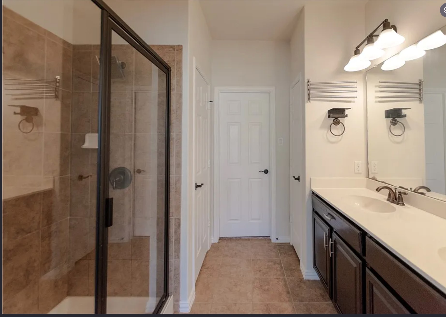 9929 Wading Pool Path Austin, TX 78748 - Photo 12 of 13 A well-appointed primary bathroom features a spacious walk-in shower and a double vanity.