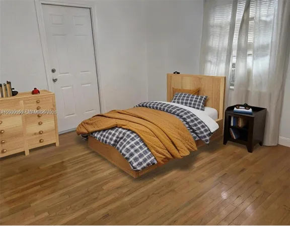 a bedroom with a bed and a mirror