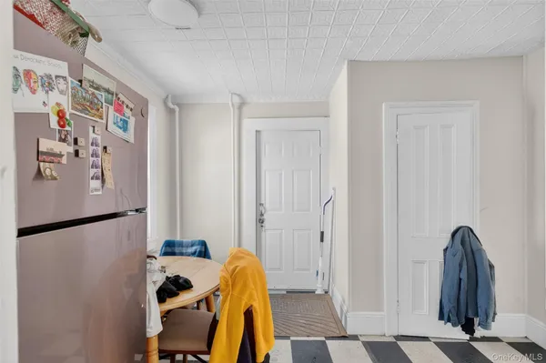 a view of a hallway with paintings on the wall
