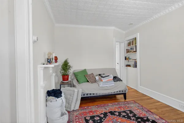 a bedroom with furniture and a rug