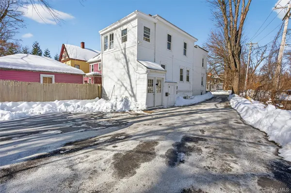 a front view of a house with a snow