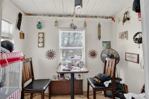 a view of a livingroom with furniture and window