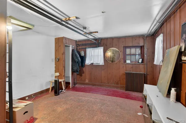 a bedroom with a bed closet and a mirror