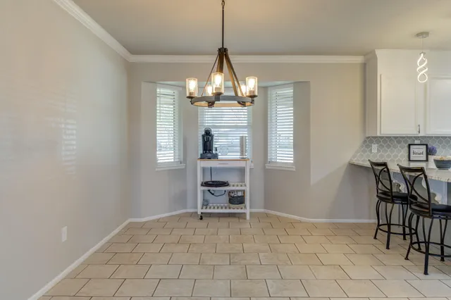 a view of a livingroom with furniture window and wooden floor
