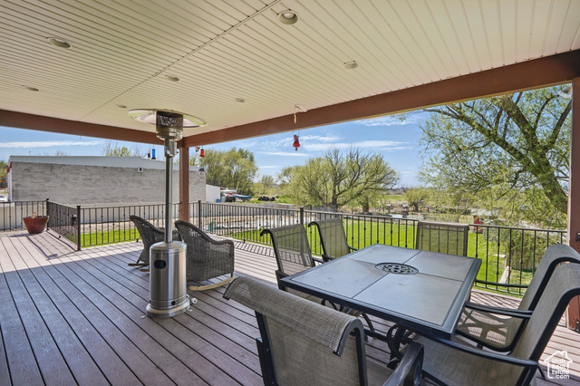 2490 South State Street Springville, UT 84663 - Photo 19 of 38 Wooden deck with outdoor dining area and a yard