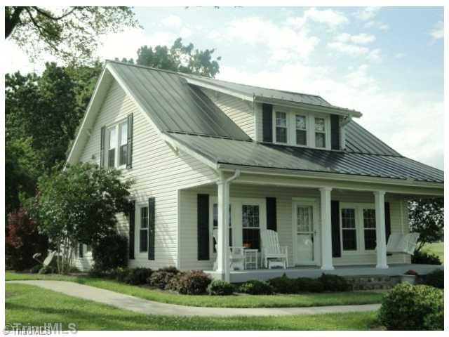 150 Ridge Road Mocksville, NC 27028 - Photo 1 of 16 Exterior Front. Beautiful Farm House with approx. 2000 Sq ft on about 5+ Acres. Custom Stone Foundation. . Also Top of the Line in Tin Roofs. House is being used for business office now but easily converted Back to Single Family Home.