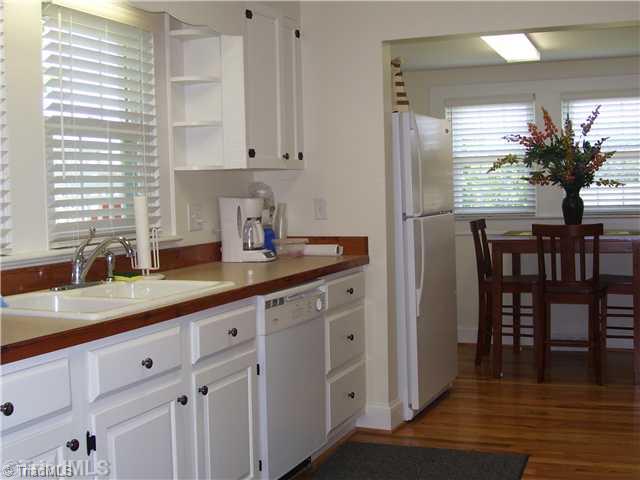 150 Ridge Road Mocksville, NC 27028 - Photo 11 of 16 Kitchen. Look out the big window over the kitchen sink and see nothing but the barns and beautiful trees and lawn.