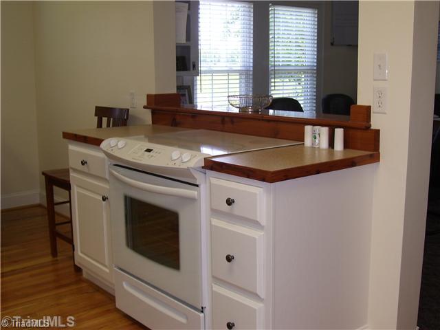 150 Ridge Road Mocksville, NC 27028 - Photo 10 of 16 Kitchen. The Range and Refrigerator will remain with the house.