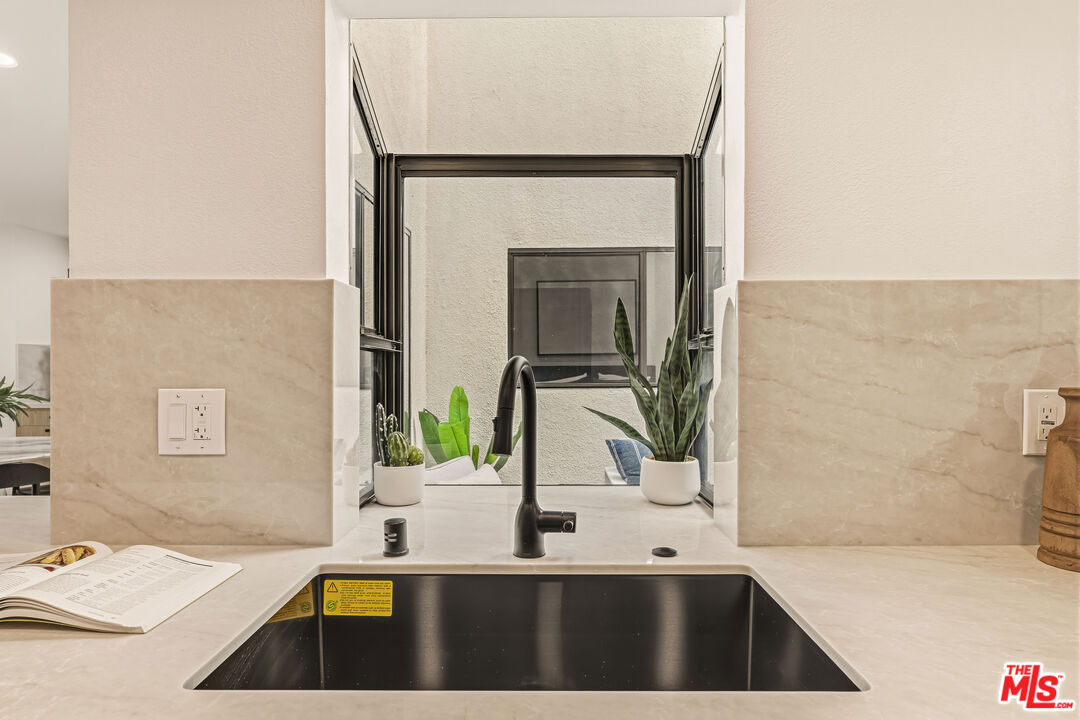 311 Bora Bora Way, Unit 3207 Marina del Rey, CA 90292 - Photo 16 of 54 a bathroom with a sink a toilet and mirror