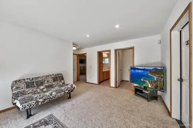 a living room with furniture and a lamp