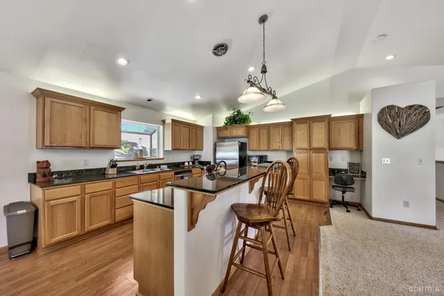 a kitchen with lots of counter top space and furniture