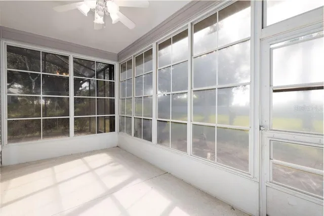 a view of empty room with windows