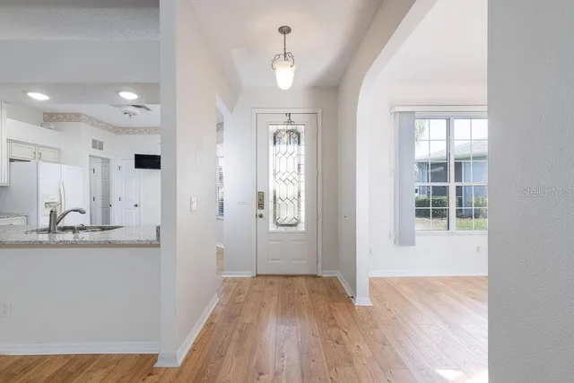 a view of a kitchen from the hallway