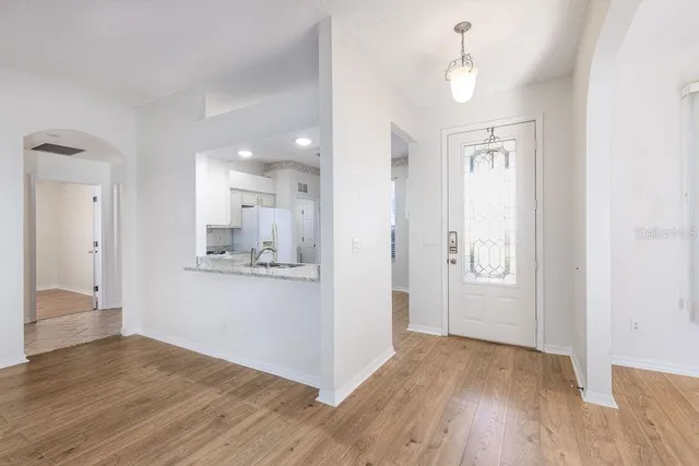 a view of a kitchen from the hallway
