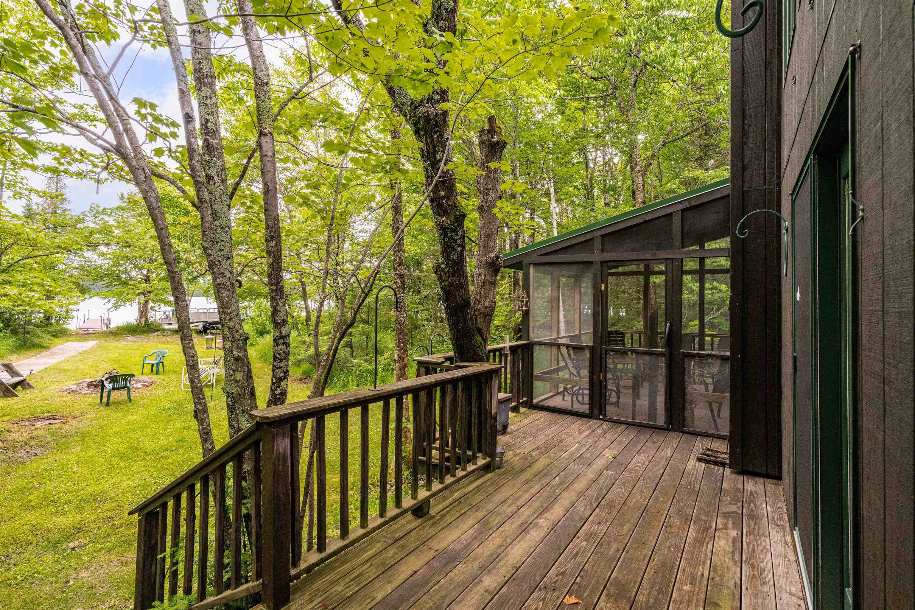 1207 Christianson Lake Road Two Harbors, MN 55616 - Photo 26 of 36 Wooden deck with a sunroom and a yard