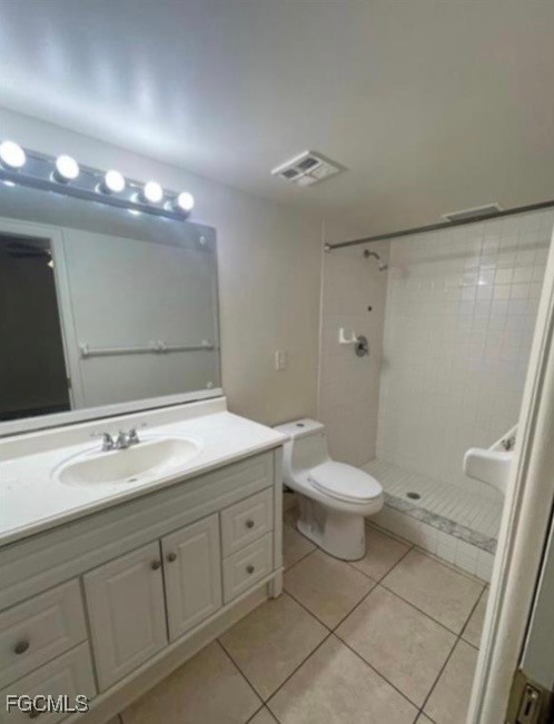 1560 Colonial Boulevard, Unit 136 Fort Myers, FL 33907 - Photo 8 of 10 a bathroom with a sink a toilet and a mirror