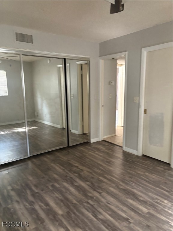 1560 Colonial Boulevard, Unit 136 Fort Myers, FL 33907 - Photo 10 of 10 a view of empty room with wooden floor