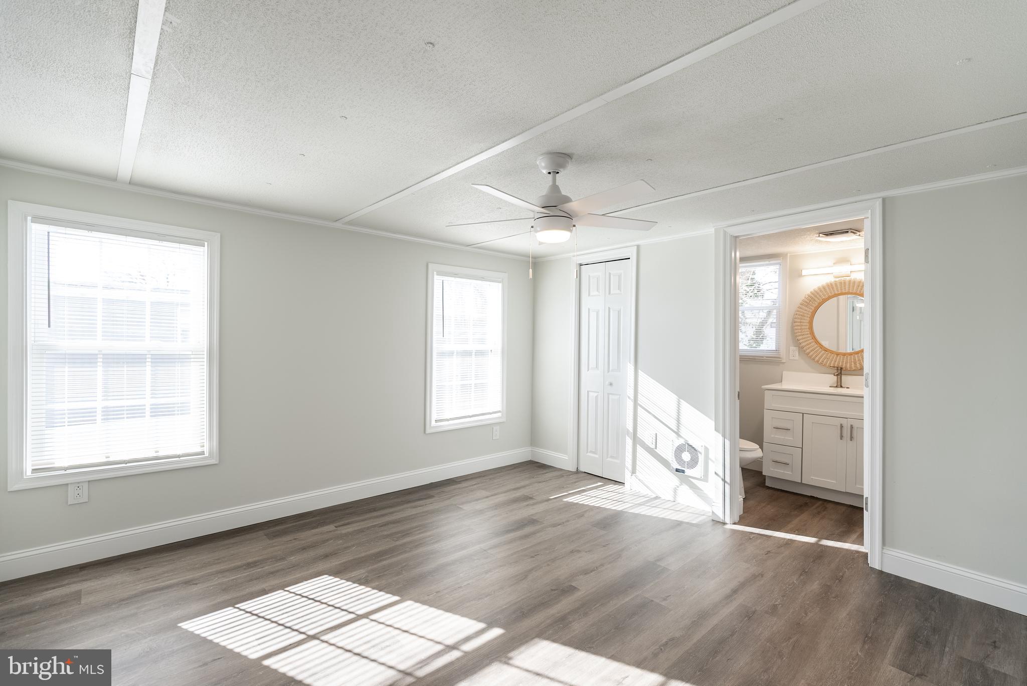 115 5th Street, Unit 40 Delaware City, DE 19706 - Photo 4 of 12 a view of livingroom with hardwood floor and window