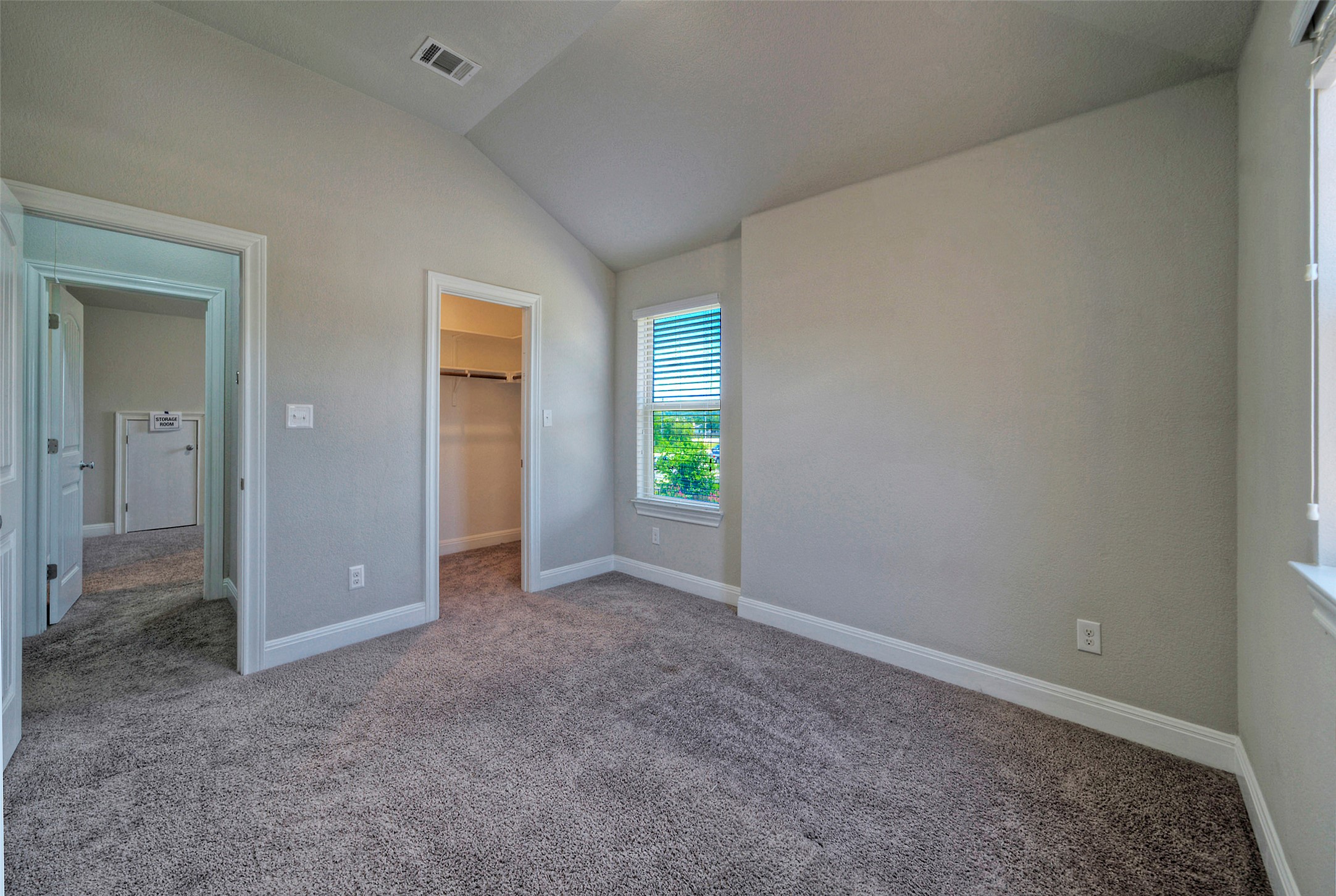 2260 Hat Bender Loop Round Rock, TX 78664 - Photo 20 of 40 A quiet bedroom with a closet and vaulted ceiling provides a comfortable retreat.