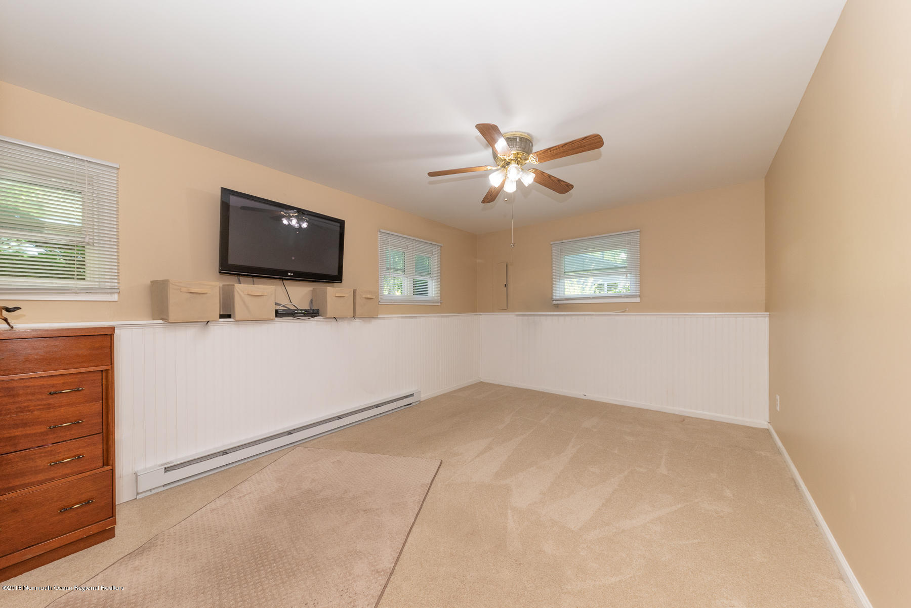 195 South New Prospect Road Jackson, NJ 08527 - Photo 15 of 28 an empty room with windows and ceiling fan